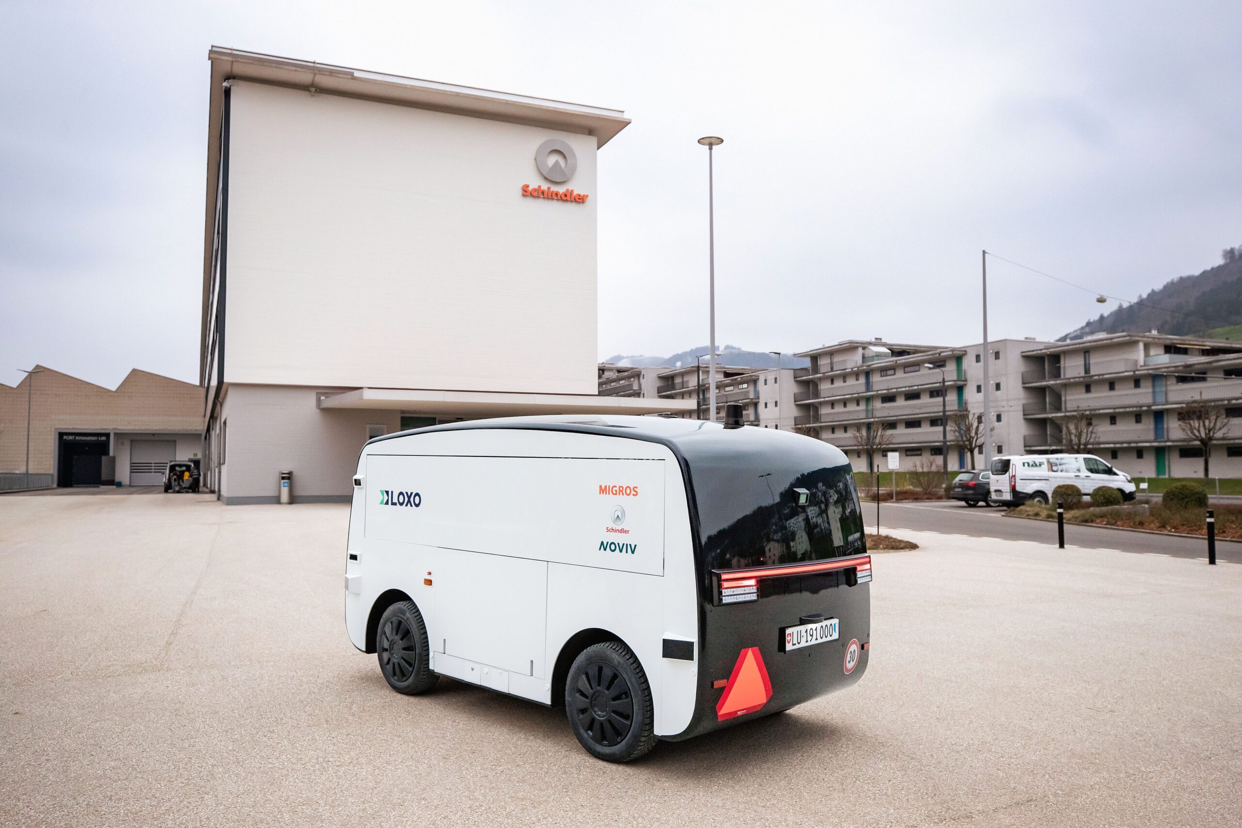 LOXO x Migros Alpha vehicle in front of Schindler